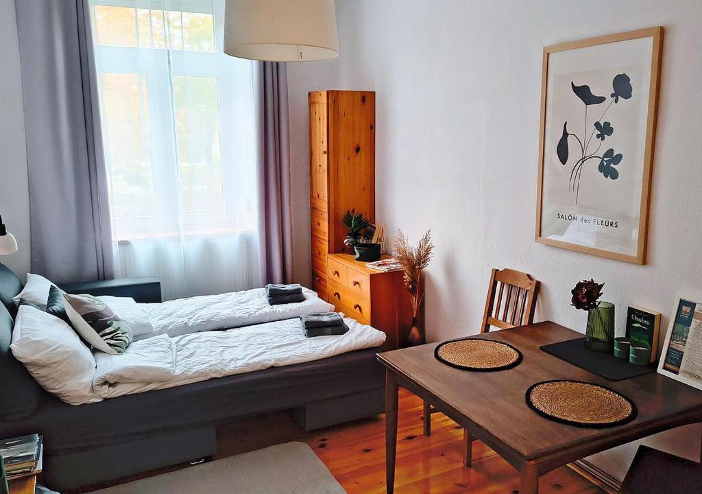 En eller flere senge i et værelse på Chrobry Square Apartament