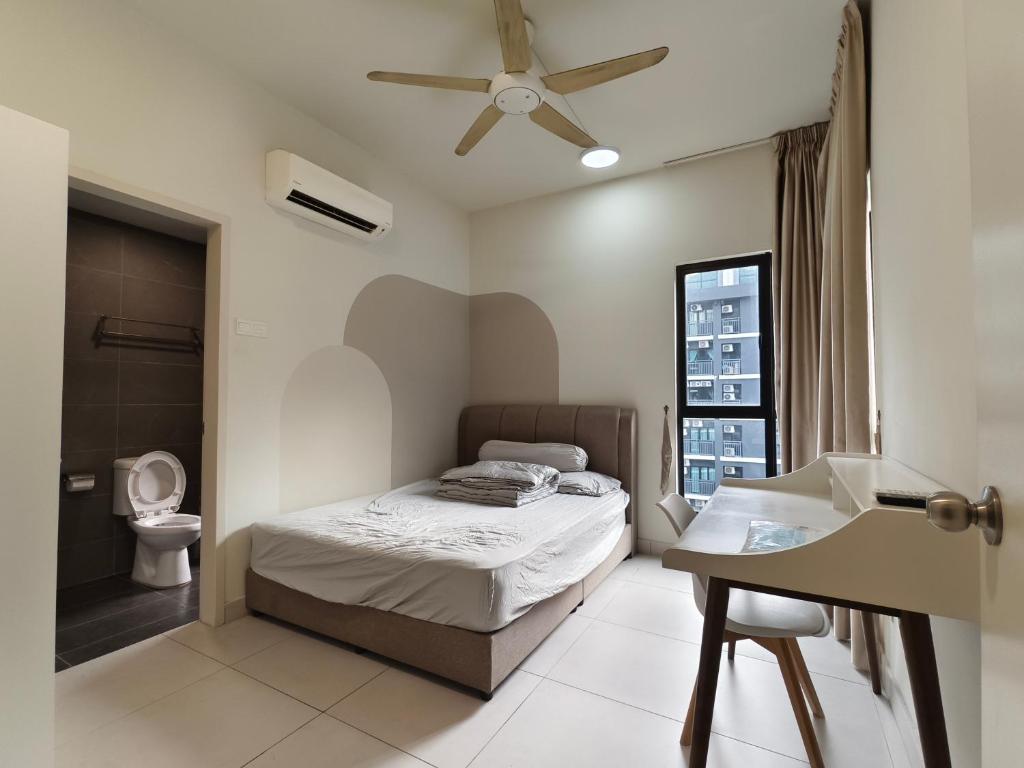 a bedroom with a bed and a sink and a toilet at Petalz resident in Kuala Lumpur