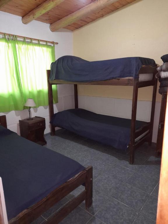 a bedroom with two bunk beds and a window at BelloLugar in San Rafael