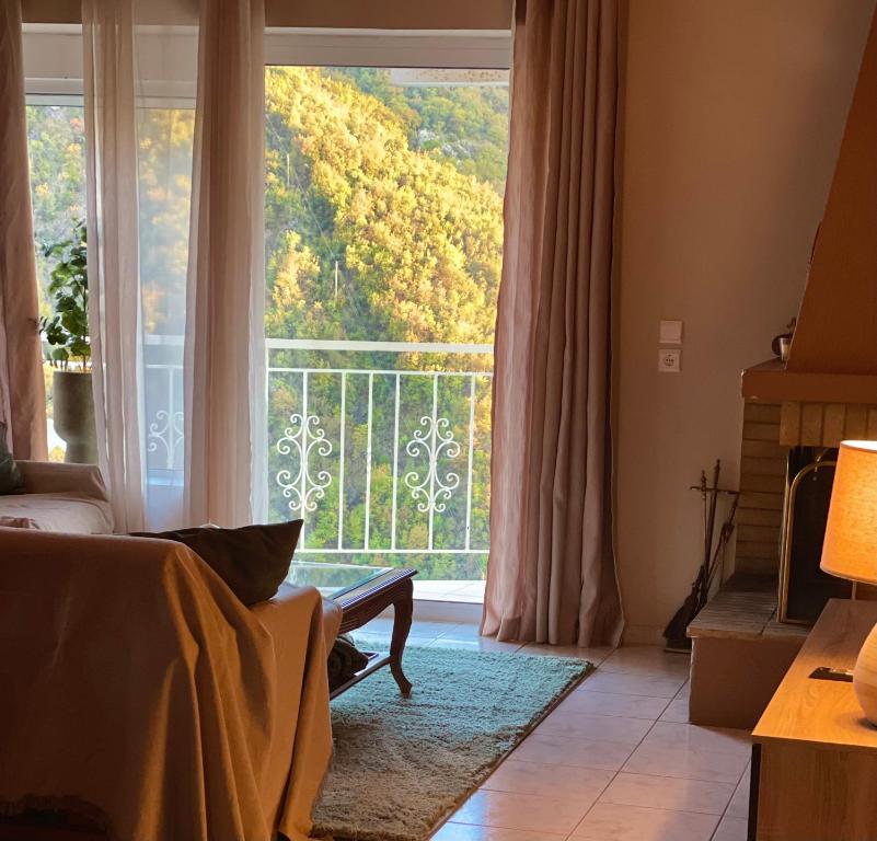 Ένα ή περισσότερα κρεβάτια σε δωμάτιο στο Arcadian Escape - Tsiaxtai Group