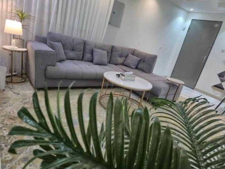 a living room with a couch and a table at نوارة المزاحمية in Riyadh