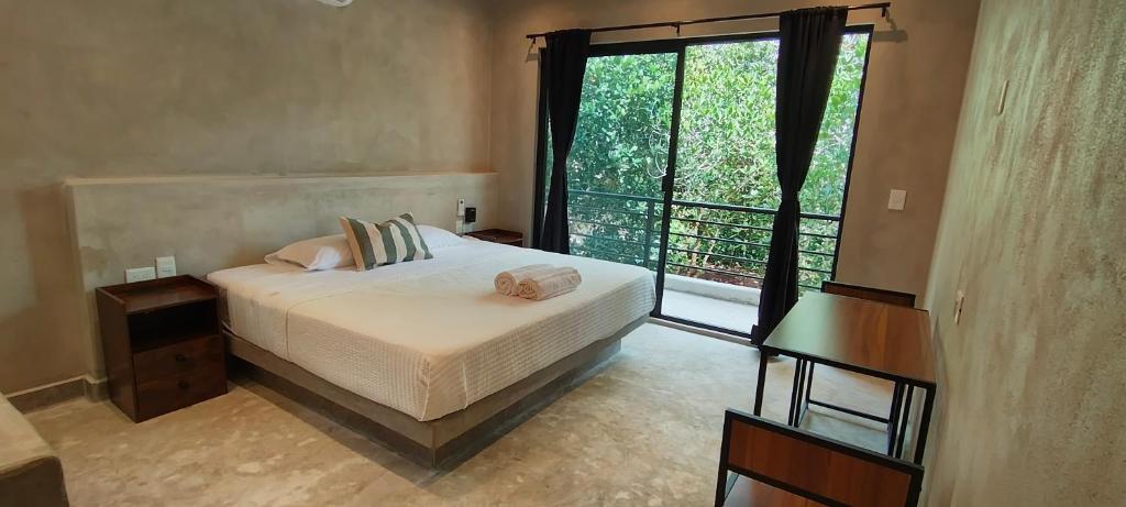 Ένα ή περισσότερα κρεβάτια σε δωμάτιο στο CASA SOLFE siete nueve nueve