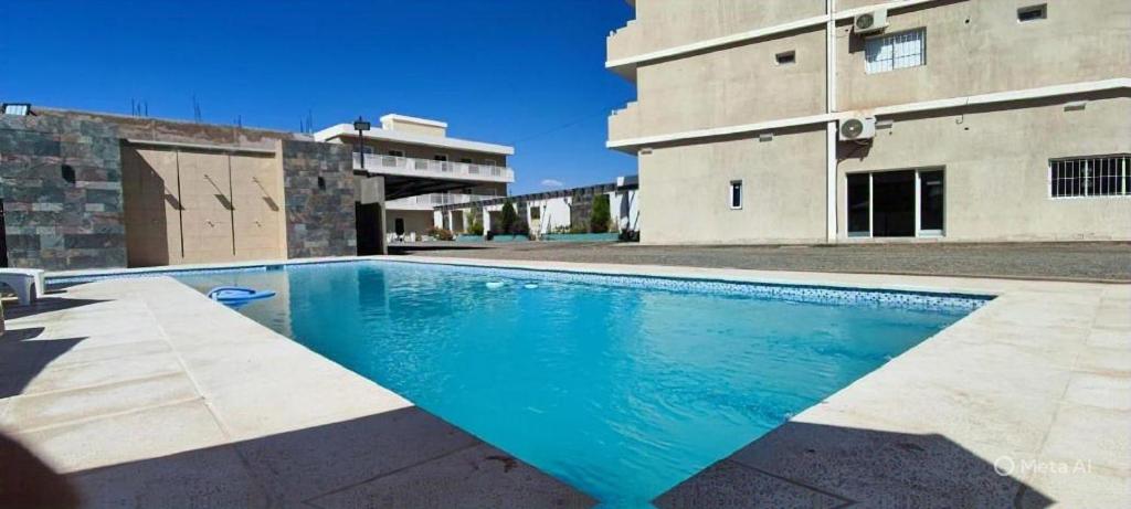 a swimming pool in front of a building at Cuesta de Miranda 2 in Villa Unión