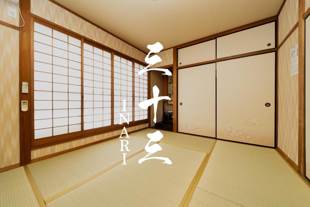 a drawing of a room with two people dancing at 三十三Inari in Kyoto