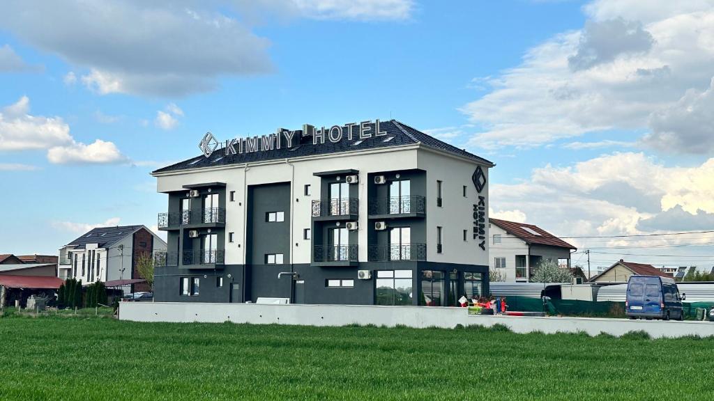 a large white building with a sign on top of it at Kimmiy in Beograd