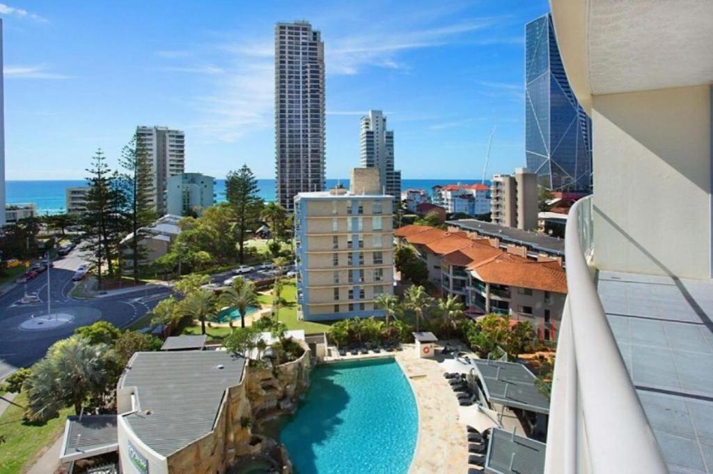 a view of a city from a building with a pool at Seabreeze Haven - Wings Resort 705 in Gold Coast