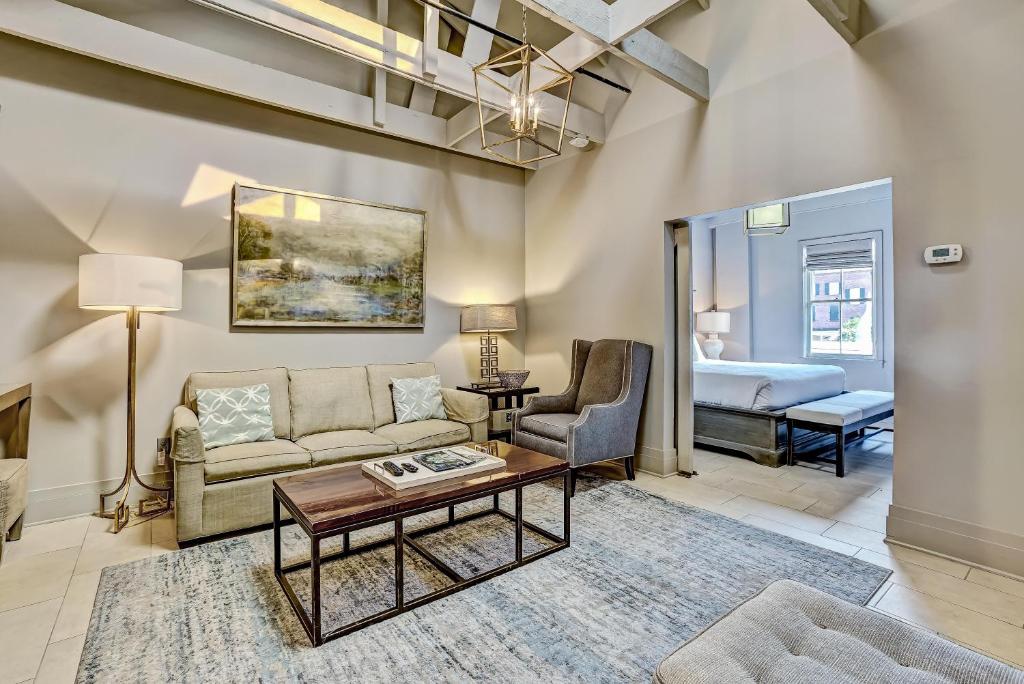 a living room with a couch and a table at Parker's Collection Unit 8 in Savannah
