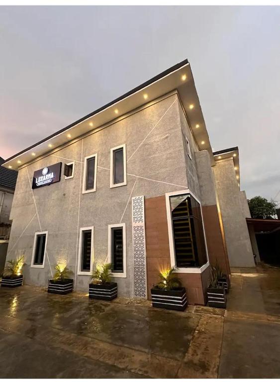 a building with lights on the side of it at Luxarna Hotel and Spa in Port Harcourt