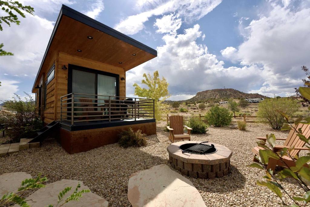 a small house in the middle of a yard at Escalante Escapes Holly Hock- King Escape in Escalante