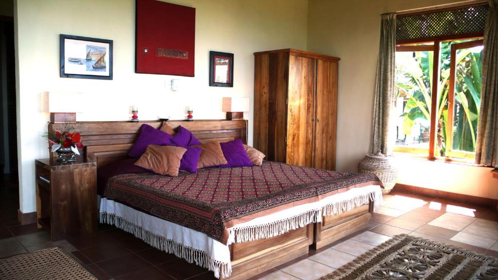 Postel nebo postele na pokoji v ubytování Rangala House