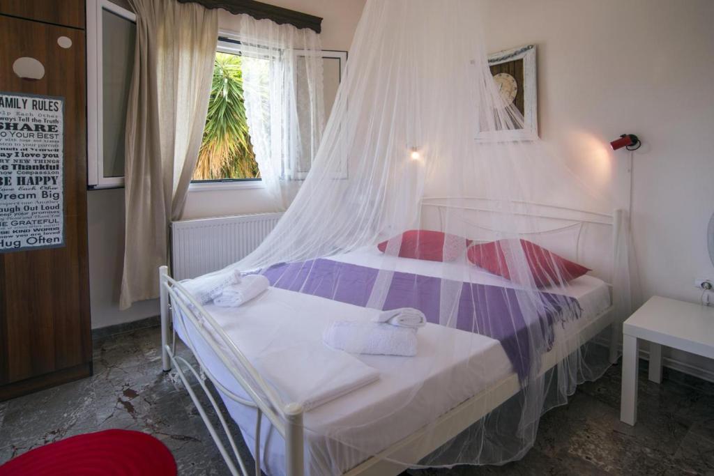 Postel nebo postele na pokoji v ubytování Alexandra Apartment