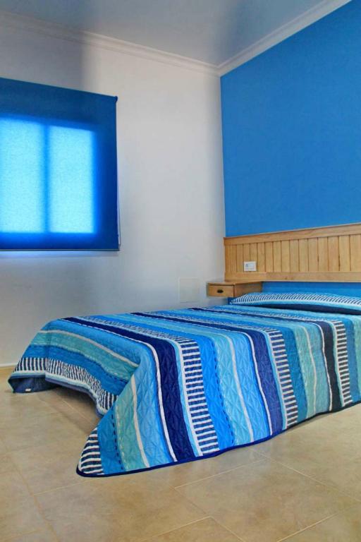 A bed or beds in a room at Chalet Arroyo Peñuelas 41