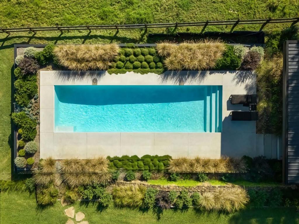 an overhead view of a swimming pool with grass at Illuka Byron - 124 Coopers Shoot Road in Coopers Shoot