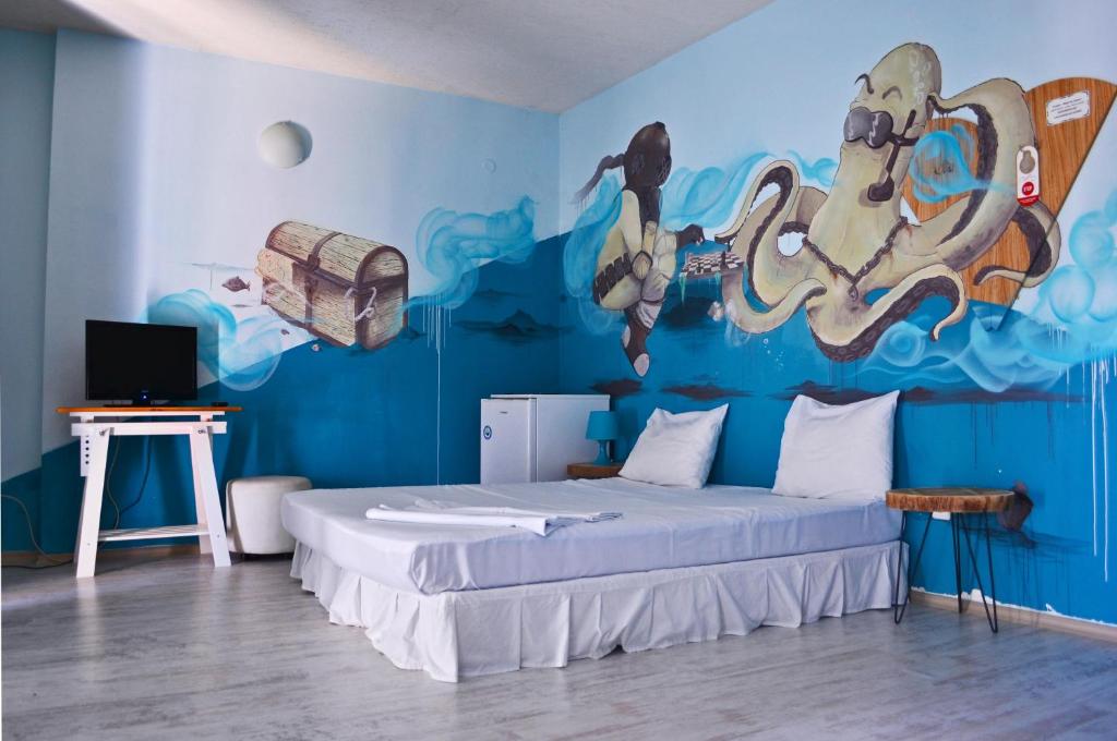 A bed or beds in a room at Art Hotel Simona