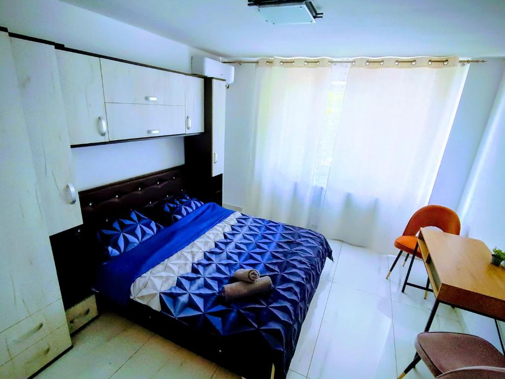 a bedroom with a bed with a heart on it at Relax Apartament in Arad
