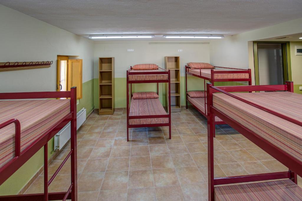 Postel nebo postele na pokoji v ubytování Alberg La Sala
