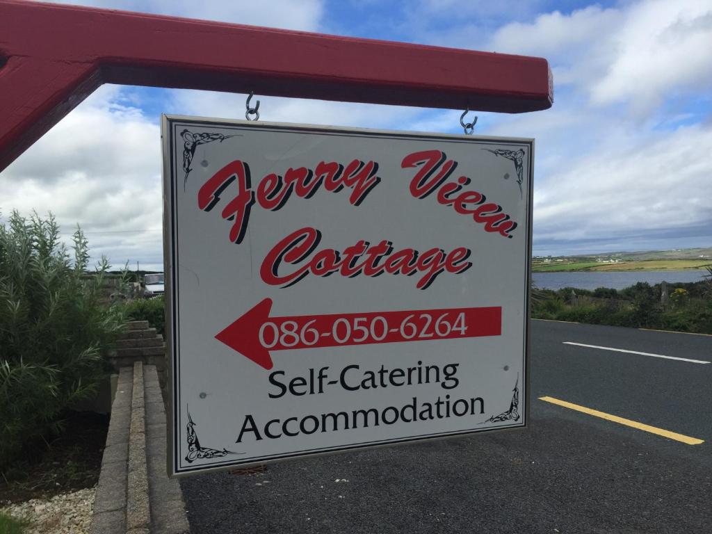 a sign for a seaky western conference on the side of a road at Ferry View Cottage in Belmullet