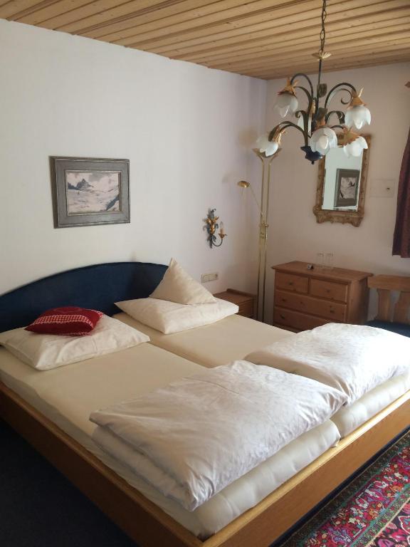 Postel nebo postele na pokoji v ubytování s'Landhaus