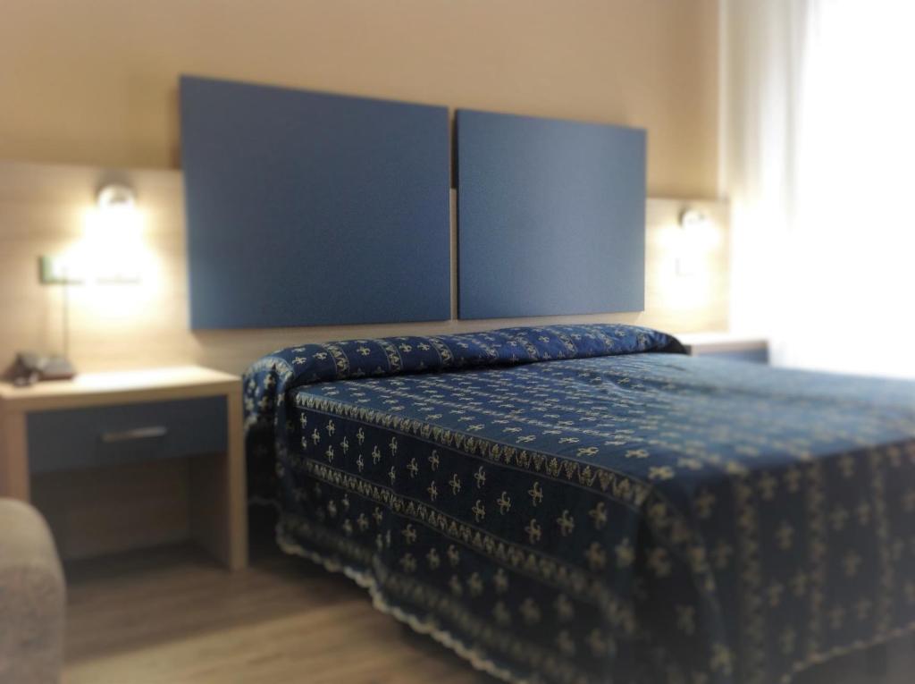 Postel nebo postele na pokoji v ubytování Hotel Ca' D'Oro