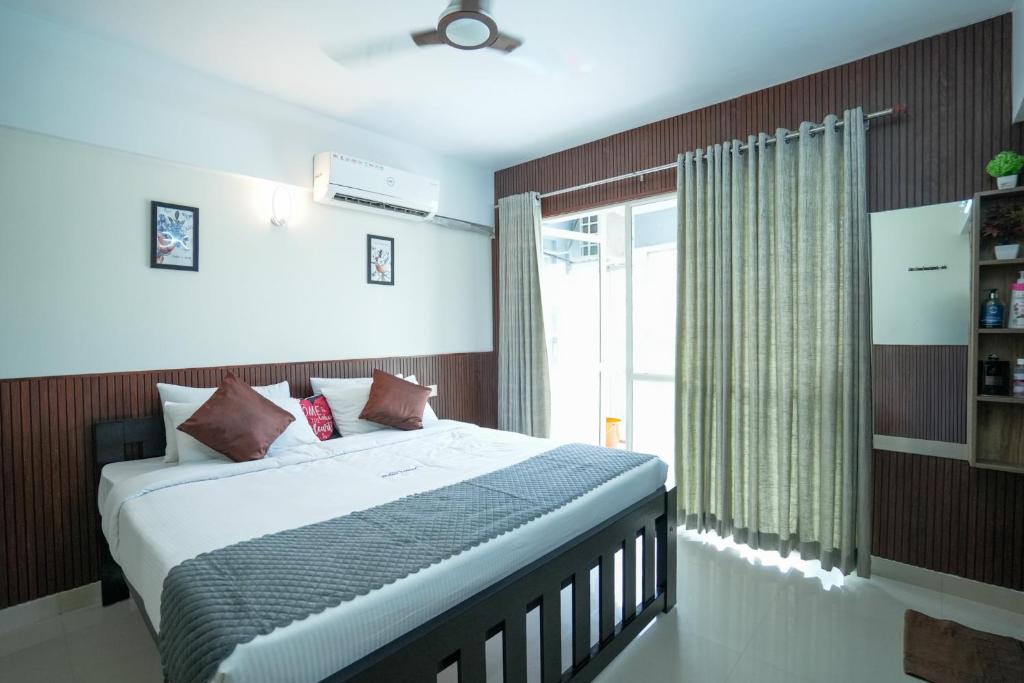 Giường trong phòng chung tại Sancta Maria Lounge -cochin Airport