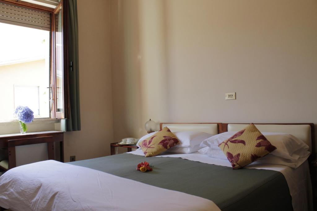 Postel nebo postele na pokoji v ubytování Hotel MariaLetizia