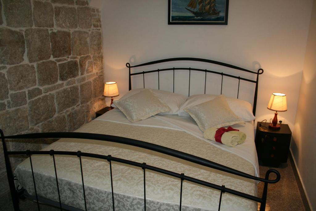 Postel nebo postele na pokoji v ubytování Rooms and Apartments Emily