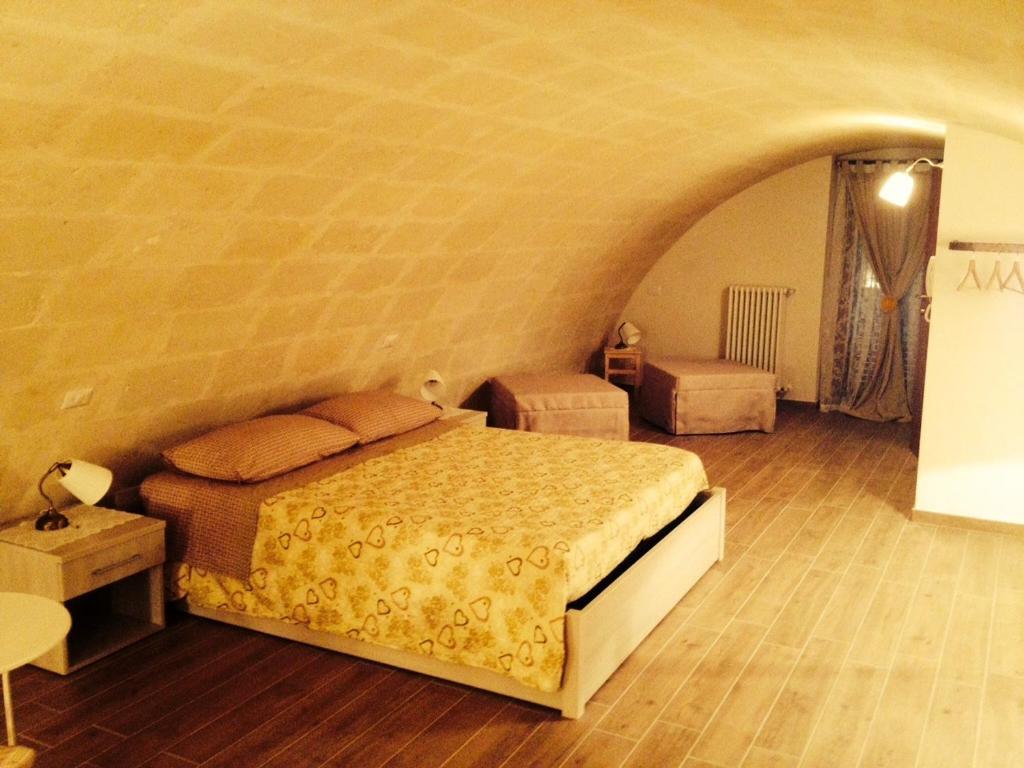 Postel nebo postele na pokoji v ubytování Le due arcate