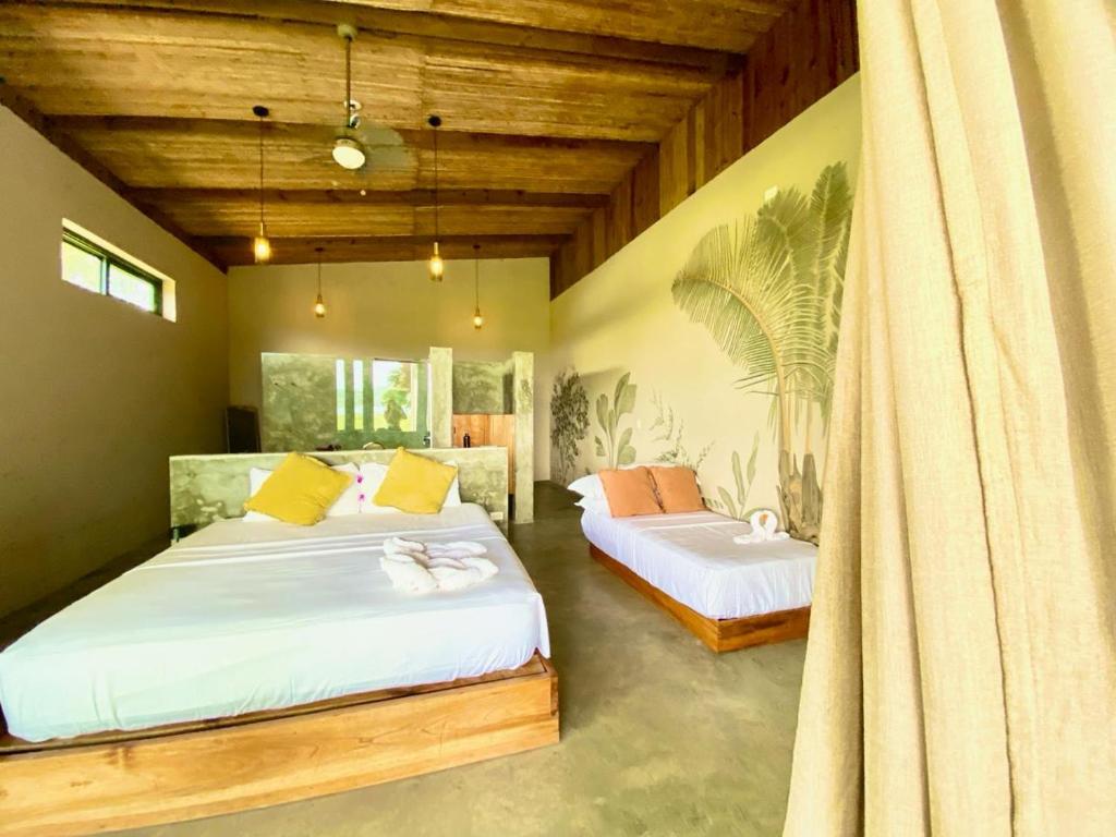 Postel nebo postele na pokoji v ubytování La Purita Ecolodge