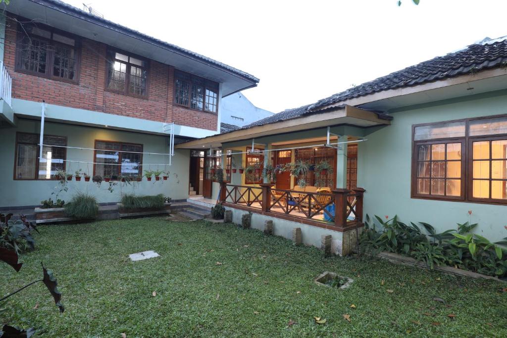a house with a yard in front of it at Imah Budi Luhur in Bandung