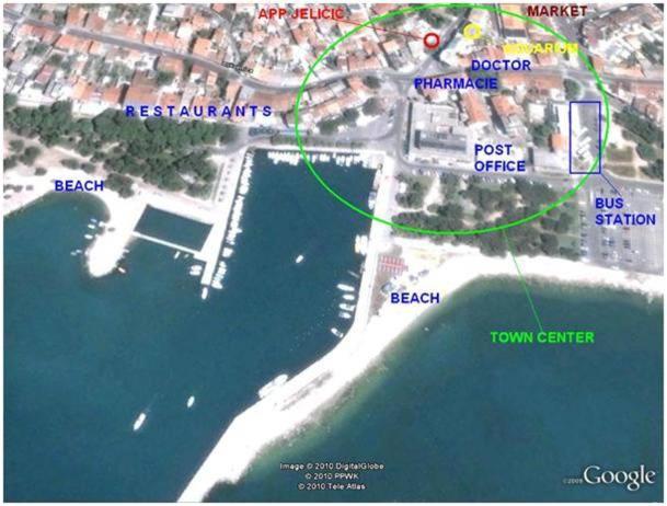 a map of a beach with a map of the ocean at Apartments Jeličić in Crikvenica