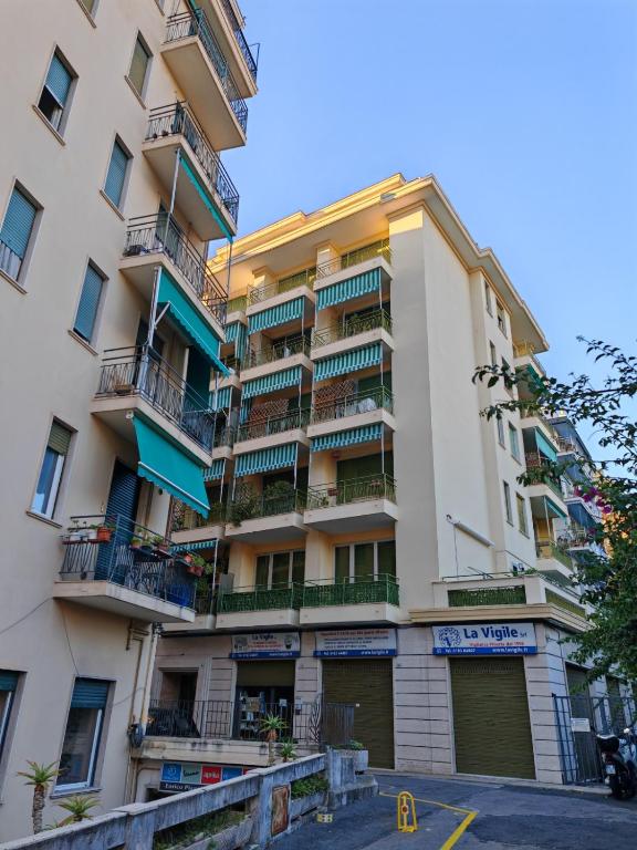 an apartment building with balconies on the side of it at La Casa di Gi&Vi in Sanremo