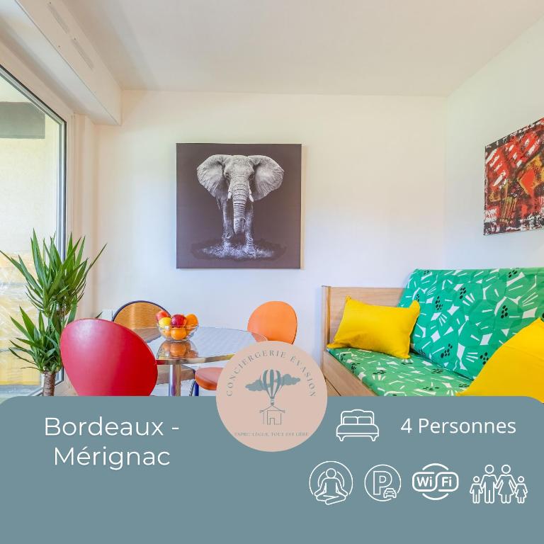 a living room with an elephant picture on the wall at Le Mérignac Cozy Corner - T3 & Terrasse in Mérignac