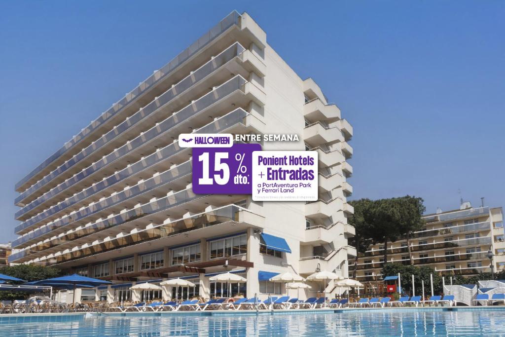 a large hotel building with a large swimming pool at Ponient Marinada by PortAventura World in Salou