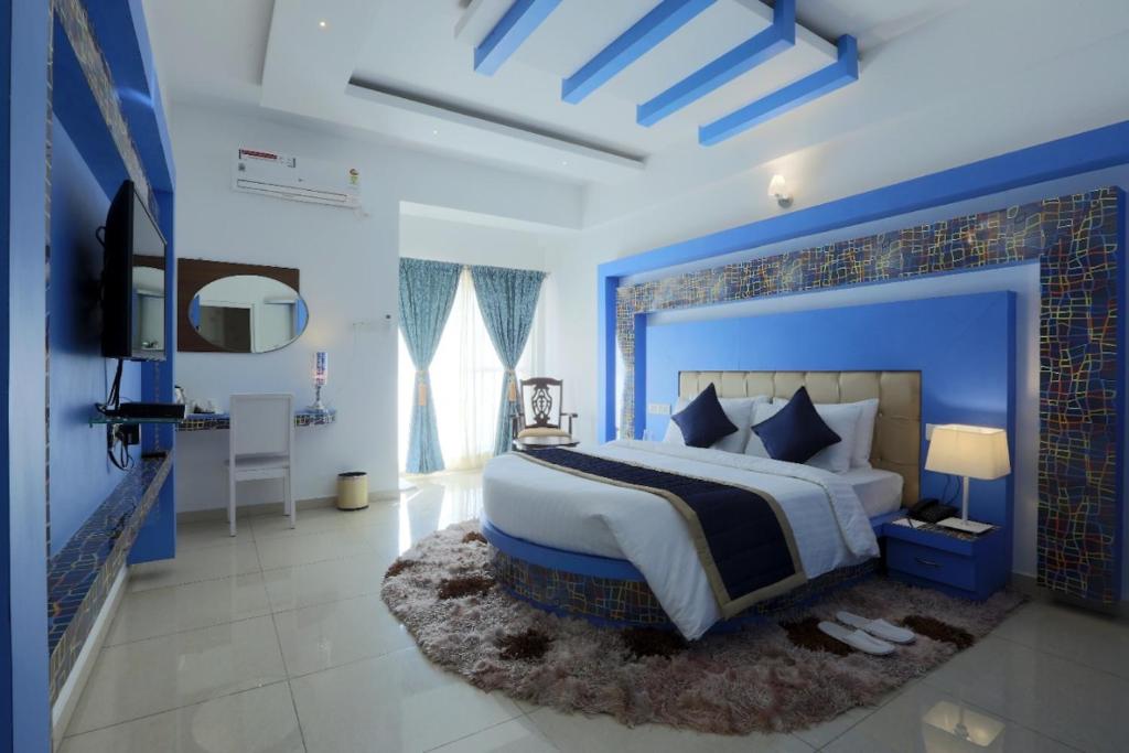 Ένα ή περισσότερα κρεβάτια σε δωμάτιο στο Premier Suites Business Hotel