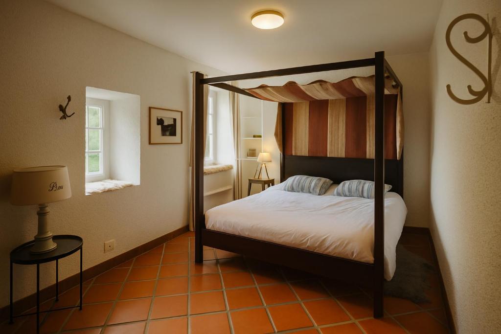 Ένα ή περισσότερα κρεβάτια σε δωμάτιο στο Au cœur des monts d'auvergne