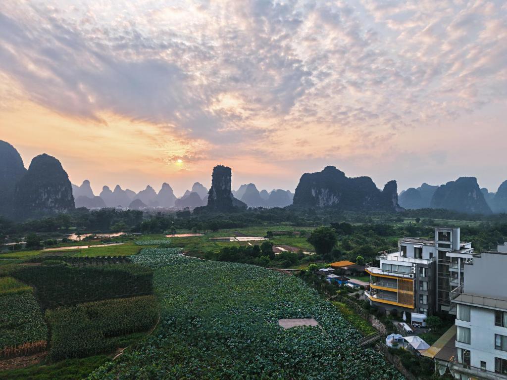 a view of the li river and mountains at sunset at Yangshuo Zen Garden Retreat - Rich Chinese traditional activities in Yangshuo