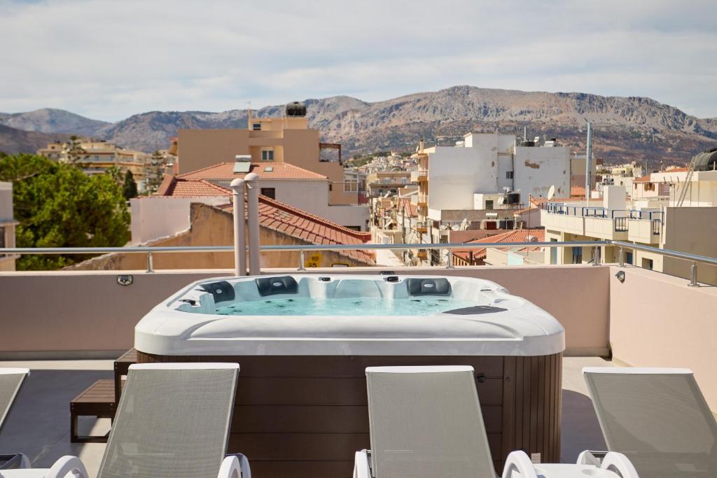 a hot tub on the roof of a building at ChioSmart Town Apartments in Chios