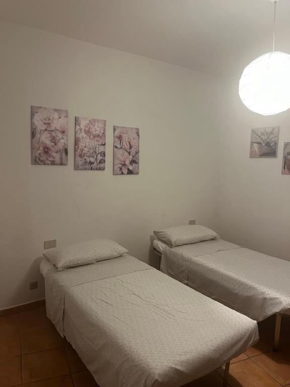 Un pat sau paturi într-o cameră la Appartamento Lucia
