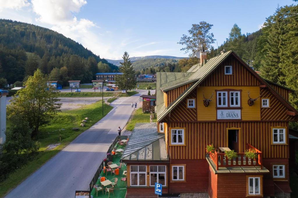 a house in the middle of a road at Hotel Diana in Špindlerův Mlýn