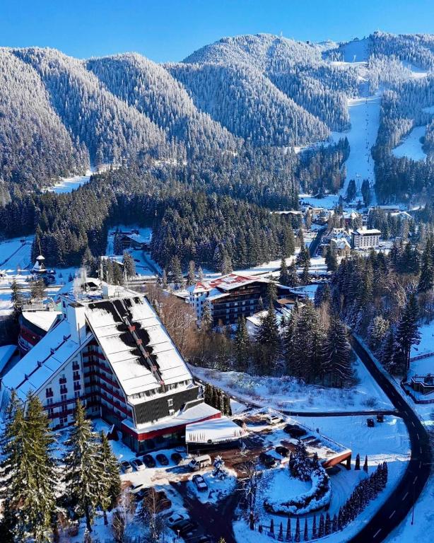 an aerial view of a ski resort in the snow at Hotel Piatra Mare in Poiana Brasov