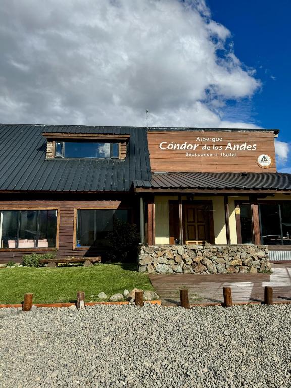 a building with a sign that reads complex western american antiques at Condor De Los Andes in El Chalten