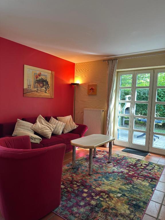a living room with a couch and a table at Küstennest Rügen in Dranske