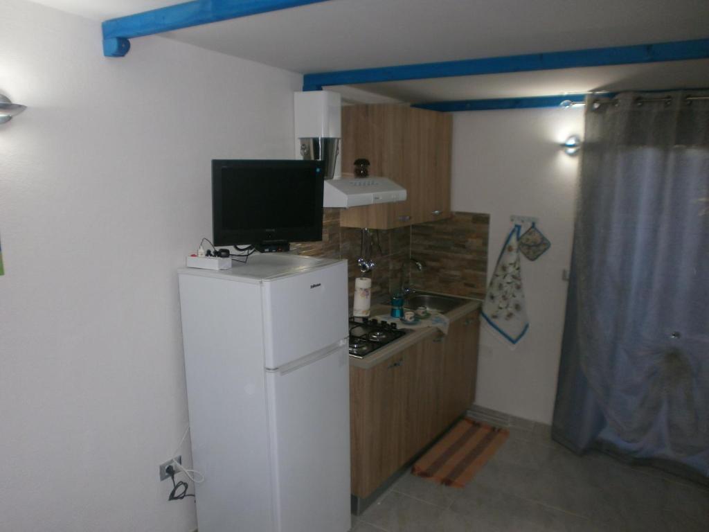 Kuchyň nebo kuchyňský kout v ubytování Rosa dei Venti