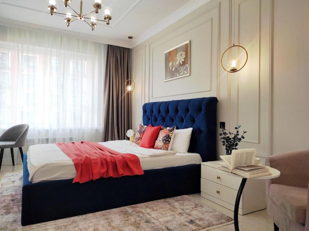 Ένα ή περισσότερα κρεβάτια σε δωμάτιο στο Островок комфорта и современности