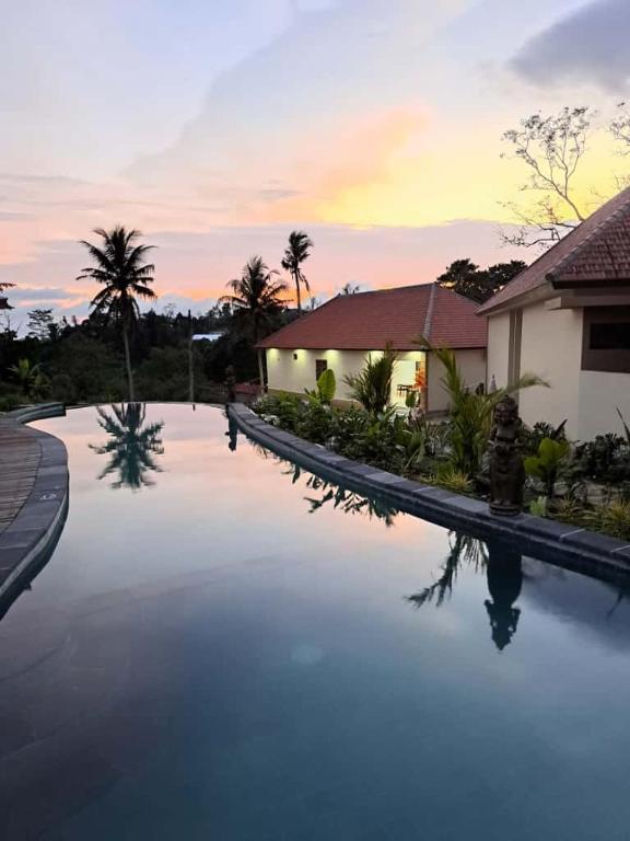 a large swimming pool in front of a house at The Green Sidemen in Silebeng