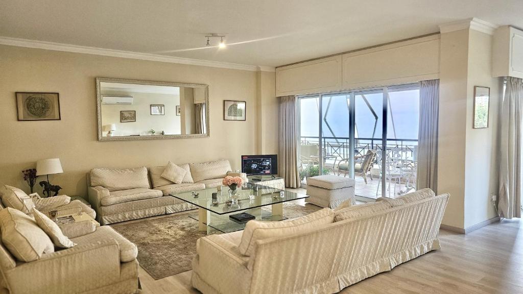 a living room with a couch and a table at STAY Charm Classic Apartment in Strovolos