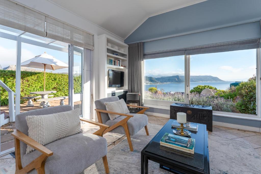 a living room with a view of the ocean at Spectacular Sea Views-Sunny Escape in Simonstown in Cape Town
