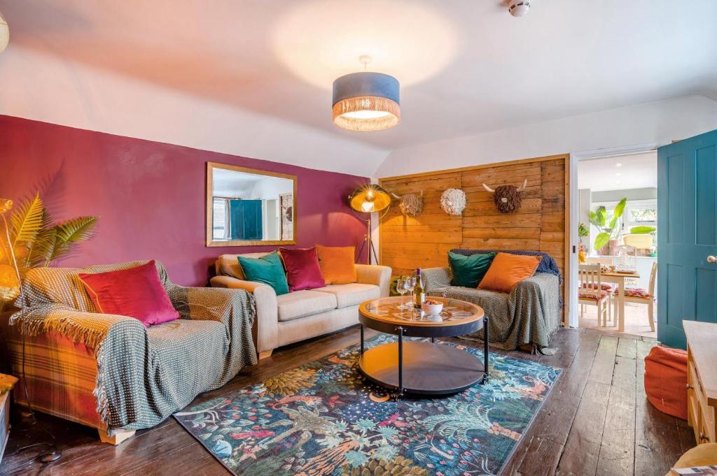 a living room with two couches and a table at 3 Bed in Wotton-under-Edge oc-l33488 in Wotton under Edge