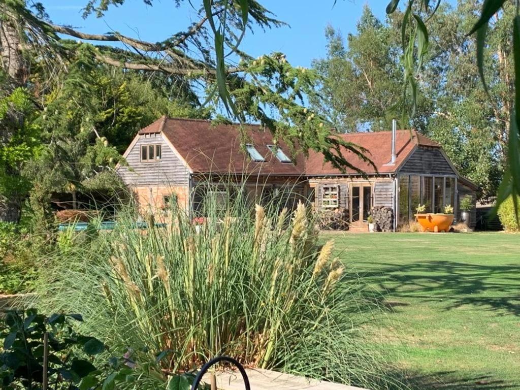 a house with a yard with a house at The Lodge, Smarden in Smarden