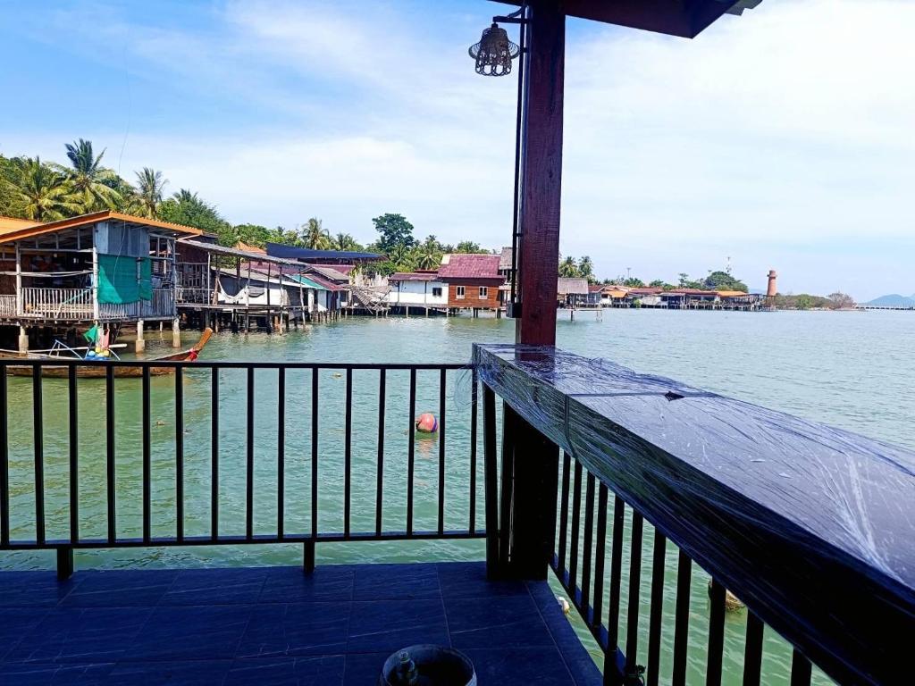 a view of the water from a balcony of a house at Sunrise House at Lanta in Ko Lanta
